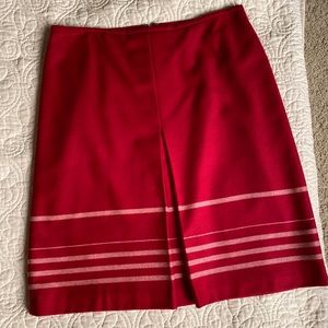 Beautiful wool A-line skirt with front pleat.